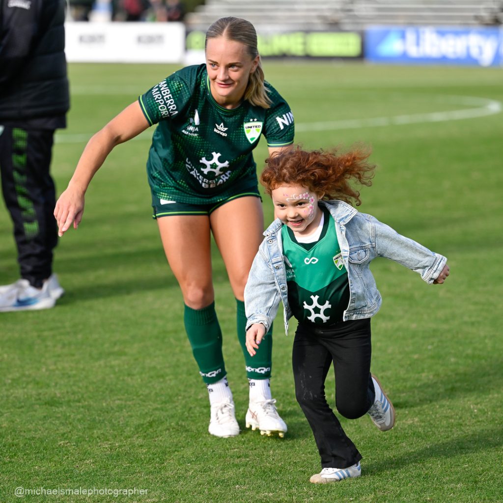 On field with family.